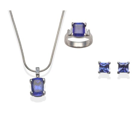 A Suite of Tanzanite Set Jewellery, including a tanzanite and diamond ring, with an emerald-cut tanzanite between two emerald