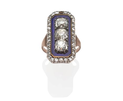A Georgian Diamond and Blue Enamel Ring, three old cut diamonds in white collet and claw settings within a canted oblong blue