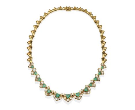 An Emerald and Diamond Necklace, heart shaped emeralds part bordered by tapered baguette cut diamonds in undulating channel s