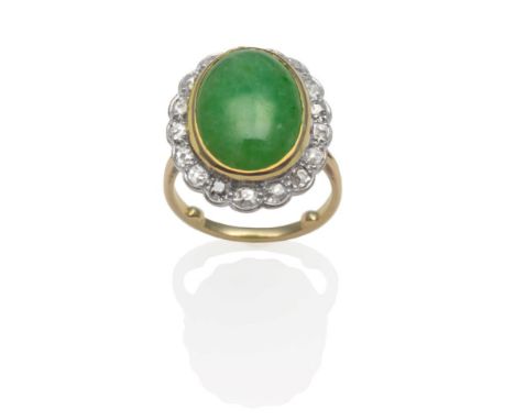 A Jade and Diamond Cluster Ring, an oval cabochon jade in a yellow rubbed over setting, within a border of old cut diamonds i