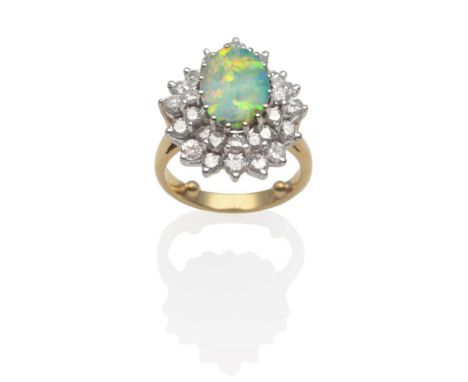 An Opal and Diamond Cluster Ring, an oval boulder opal within an undulating two tier border of round brilliant cut diamonds i