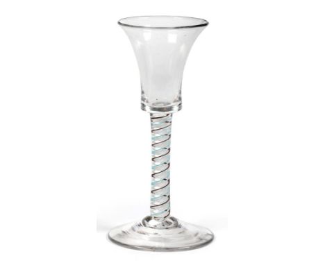 A Colour Twist Wine Glass, circa 1765, the flared bucket shaped bowl on a brown, green and white twist stem, 15cm high See il