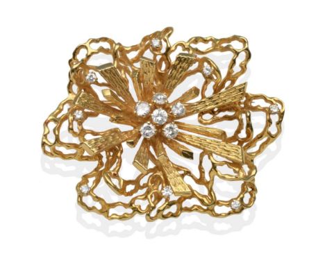 An 18 Carat Gold Diamond Brooch, a central cluster of six round brilliant cut diamonds in yellow claw settings with radiating