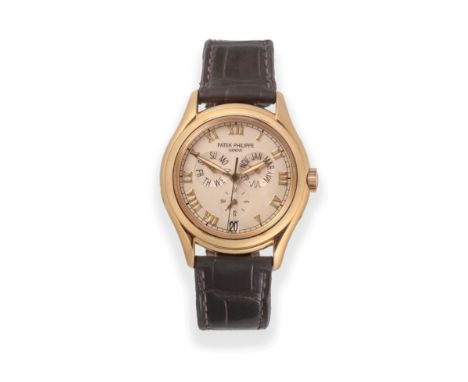 A Fine 18ct Yellow Gold Automatic Annual Calendar Centre Seconds Wristwatch with 24 Hour Indication, signed Patek Philippe, m