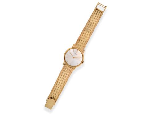 An 18ct Gold Wristwatch, signed Universal, Geneve, circa 1970, lever movement signed, silvered dial with baton markers, snap-