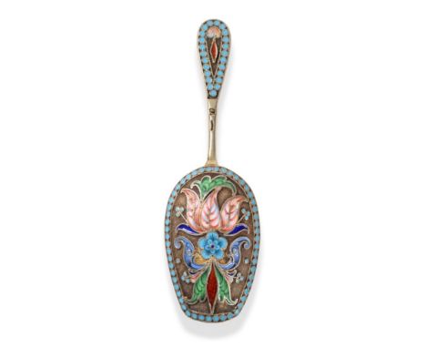 A Russian Silver Gilt and Cloisonne Enamel Caddy Spoon, left facing Kokoshnik Mark (1896-1908), maker's mark not clear, the b