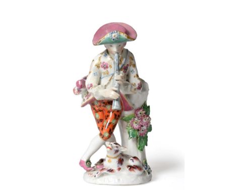 A Bow Porcelain Figure of a Shepherd, circa 1765, leaning against a tree trunk playing pipes, his dog at his feet, on a mound