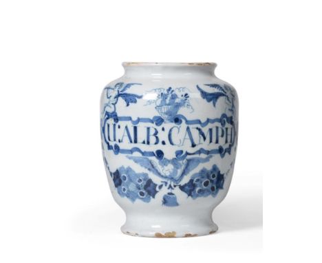 An English Delft Drug Jar, possibly London, circa 1720, inscribed in blue U:ALB:CAMPH within a scroll label surmounted by a b