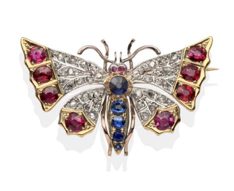 A Victorian Diamond, Ruby and Sapphire Butterfly Brooch, the wings set throughout with rose cut diamonds and terminating with