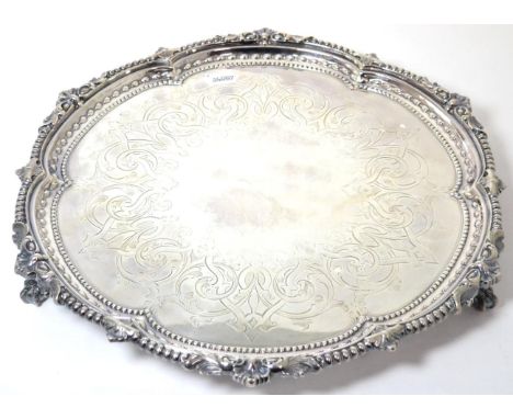 A Victorian Silver Salver, Martin, Hall & Co (Richard Martin & Ebenezer Hall), London 1867, circular with a shaped rim, the c