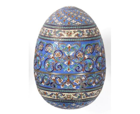 A Continental Silver and Cloisonne Enamel Egg, bears pseudo Russian marks, profusely decorated in polychrome enamel with styl