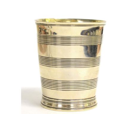 A George III Silver Beaker, Henry Chawner, London 1788, tapering circular with ribbed bands, the interior gilt, 10cm high, 5o