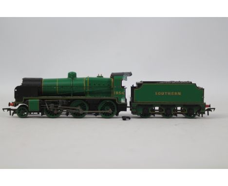 Hornby - an OO gauge model 2-6-0 locomotive and tender, running no 1854, Southern lined green livery, untested and not checke