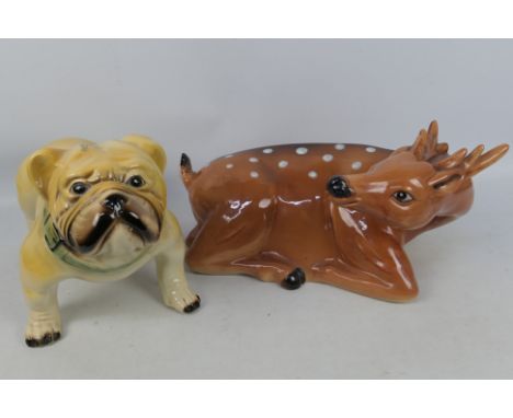 A large ceramic model of a deer, approximately 48 cm (l) and a model of a bulldog.

Condition Report: No significant damage t