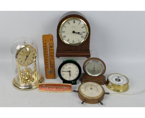 A collection of clocks and thermometers to include a Woodford mantel clock.