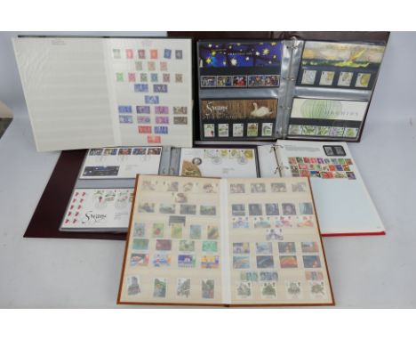 Philately - Lot to include first day covers, mint stamp presentation packs (approximately £50 face value), stock book contain