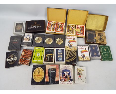 Guinness - A collection of Guinness branded playing cards including factory sealed examples.