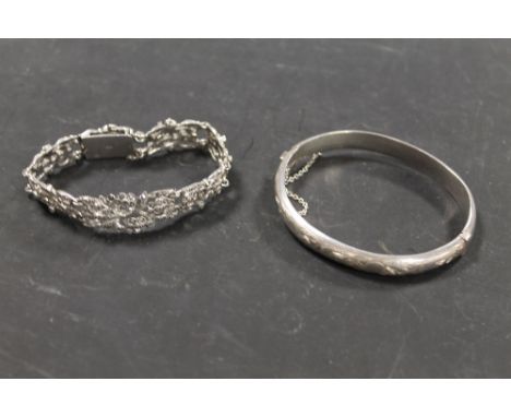 aA SILVER BANGLE AND A SILVER BRACELET