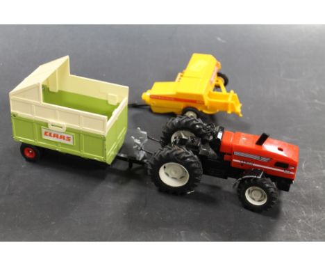 A QUANTITY OF BRITAINS TOYS, TO INCLUDE A TRACTOR AND TRAILER ETC.
