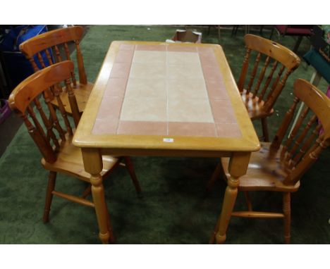 A TILE TOPPED DINING TABLE AND FOUR CHAIRS