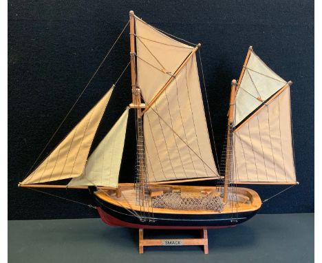 A wooden model ship, Smack, 49cm high, 59cm long. 