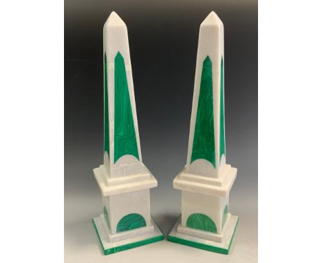 A pair of malachite green and light grey stone obelisks, 41cm high 