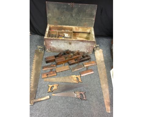 A large painted pine carpenter's chest, containing an assortment of wood working tools, planes, saws, including Diston, Green