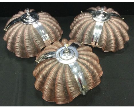 A pair of 1930s chrome and pink glass shell shaped ceiling light shades, 35cm diameter;  another similar 33cm wide (3). 
