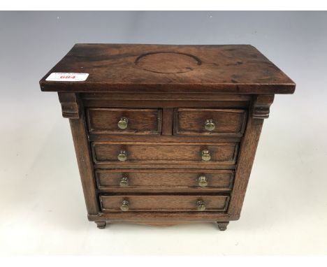 An apprentice type miniature mahogany Scotch chest