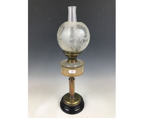 A brass and glass columnar oil lamp with florally etched shade, 63 cm