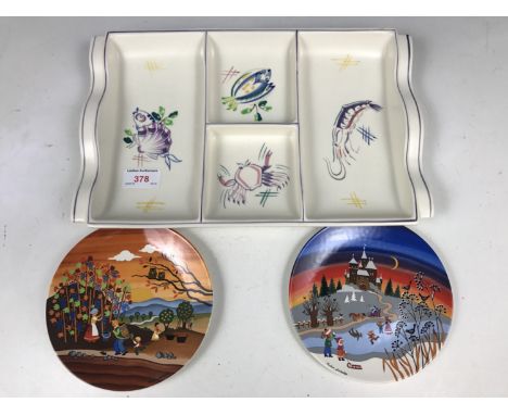 A Poole Pottery hors d'oeuvres dish together with two Poole plates