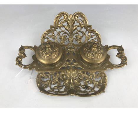 A Geschutzt brass double inkwell