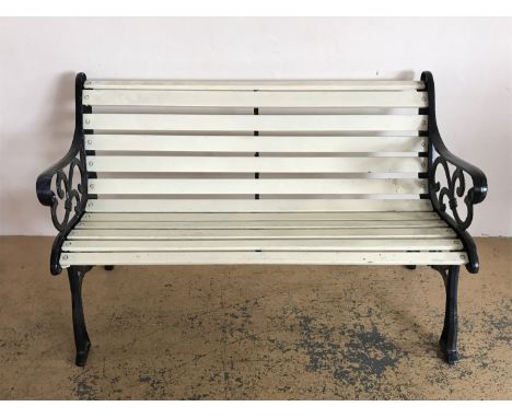 A cast iron and timber garden bench