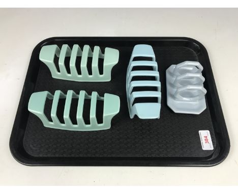 Four Poole Pottery toast racks