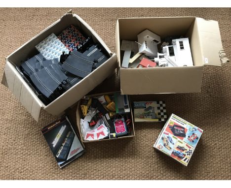 A large collection of vintage Scalextric electric model racing track and accessories, including boxed track, a boxed Triang K