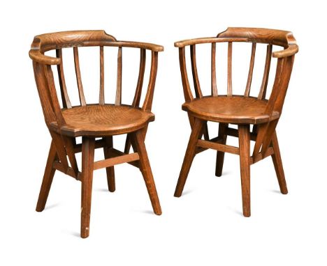 Arthur Romney Green (1872-1945), a pair of Arts & Crafts oak armchairs, circa 1920,   the curved backs with lozenge carving, 