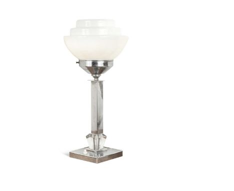 An Art Deco chrome table lamp,  with a stepped milk glass shade above a square column and plinth base44cm highIn generally go