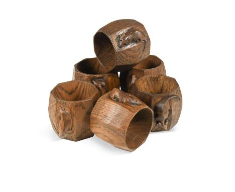 Robert 'Mouseman' Thompson, a group of six oak napkin rings, of octagonal barrel form and each carved with mouse signature5cm