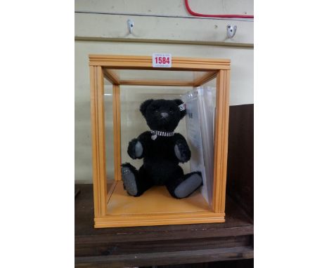 Steiff: a 2011 'Krystina' black mohair growler bear, having Swarovski crystal collar and ear stud, certificate no. 1392, 30cm