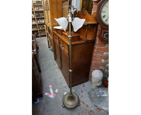 A brass adjustable twin light standard lamp.&nbsp; 