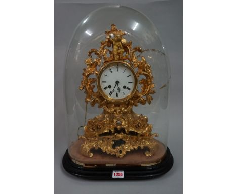 A late 19th century gilt brass mantel clock, in rococo style, the enamel dial inscribed 'Miroy Fres, a Paris', striking on a 