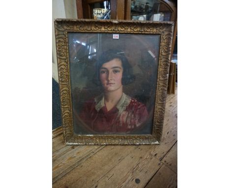 British School, early 20th century, head and shoulders portrait of a young lady, in a painted oval, oil on canvas, 60 x 50cm.