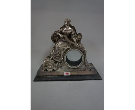 A late 19th century electroplated figural mantel clock case,&nbsp;30cm high, (no movement).&nbsp; 
