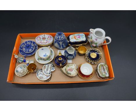 A small group of miniature ceramic items,&nbsp;to include a Meissen cup and saucer.&nbsp; 