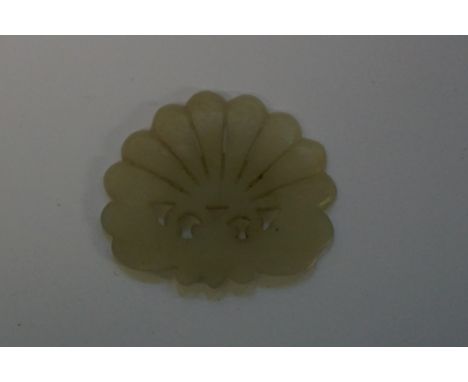 A Chinese carved celadon jade carving of a butterfly and flower,&nbsp;5.7cm wide. 