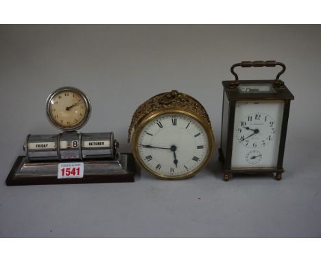 A 1930s combined timepiece and desk calendar,&nbsp;15.5cm wide; together with a brass carriage clock, with alarm and bell str