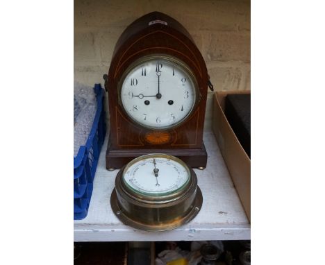An Edwardian mahogany and inlaid lancet form mantel clock,&nbsp;28.5cm high; together with a brass bulkhead aneroid barometer