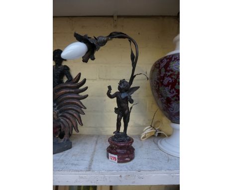 A spelter cherub table lamp, on marble socle, 40cm high. 