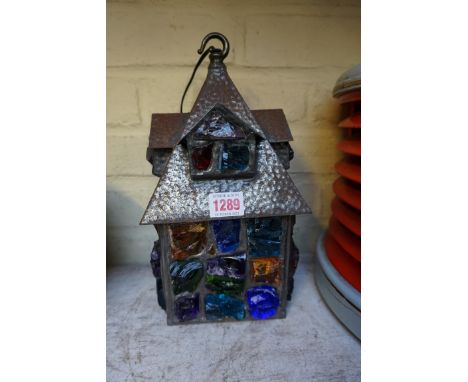 A leaded and coloured glass lantern, 29cm high.PLEASE NOTE THE ADDITIONAL LAMP HAS BEEN WITHDRAWN.