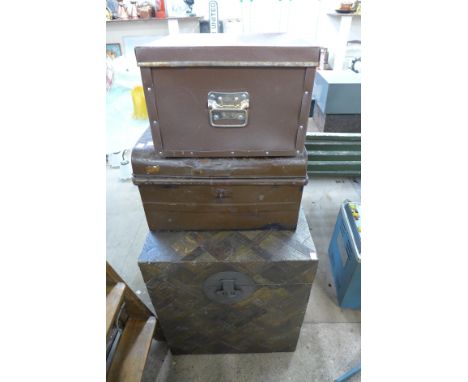 A wooden box, tin trunk and another box
